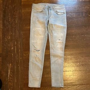 Light wash American Eagle skinny jeans.